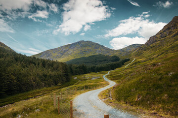 Fototapeta na wymiar Path in mountains of scotland, blue sky
