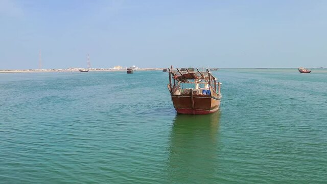 Stranded dhow boat at Gulf Oman shores Indian ocean