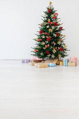 Christmas tree pine with gifts for the new year interior postcard banner background