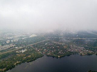 High aerial view of Kiev and the Dnieper river from under the clouds.