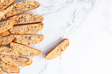 Fresh biscotti cookies on the white marble background with a copy space