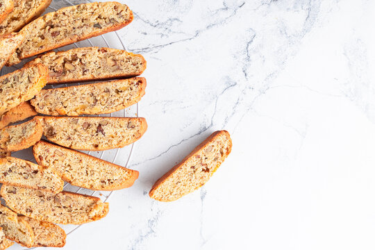Fresh biscotti cookies on the white marble background with a copy space