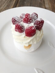 Anna Pavlova cake with cream and berries 