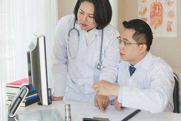 Expertise cancer doctor advising doctor for cure the patient in the in office.