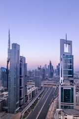 Fototapeta na wymiar Sunrise in Dubai with empty roads