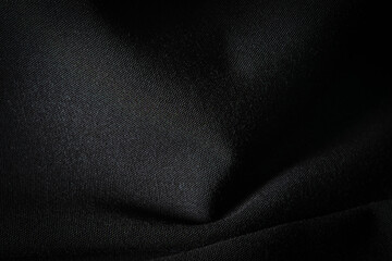 Black fabric, luxury dark gray background abstract. Material are used in textile assembly. Detail...