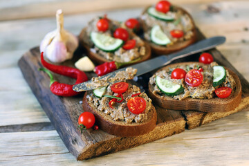 Sandwiches with pate on a wooden board. Healthy snack. Selective focus. Macro.