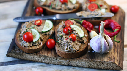 Sandwiches with pate on a wooden board. Healthy snack. Selective focus. Macro.