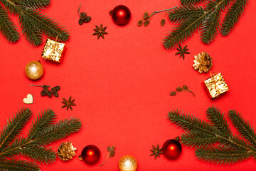 Naklejka na ściany i meble Christmas composition, red Christmas balls with Christmas tree on red background