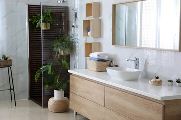 Bathroom interior with shower stall, counter and houseplants. Idea for design