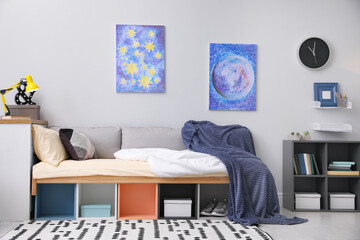 Modern teenager's room interior with comfortable bed and stylish design elements