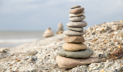 Fototapeta na wymiar The balanced stones at the beach