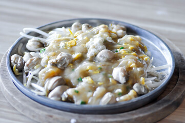 Oyster omelette or stir fried Oyster with egg and vegetable