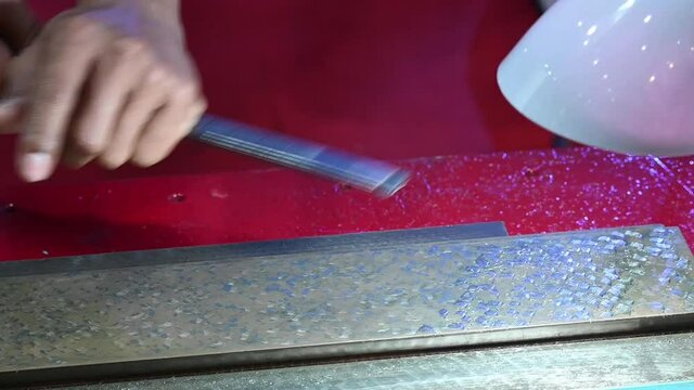 The operation of CNC machine slideway scraping process with skill worker. The material removal for prepare flatness on CNC structure.