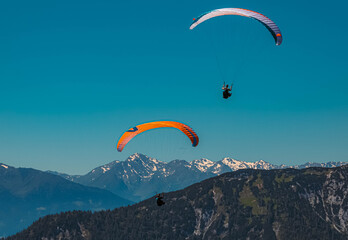 Beautiful alpine view with paragliders at the famous Rofan summit, Maurach, Achensee, Pertisau, Tyrol, Austria