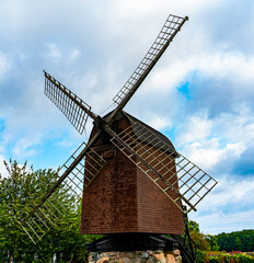 Fototapeta na wymiar Traditional medieval wind mill for milling flour from wheats.