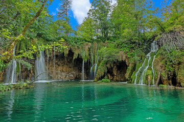 Picture of a waterfall in the Plitvice Lakes National park in Croatia with long exposure during daytime