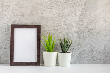 Empty photo frame on a table or shelf with a copy of the place