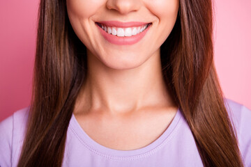 Closeup cropped photo of beautiful woman with brunette hair smiling with white teeth isolated on pastel pink color background