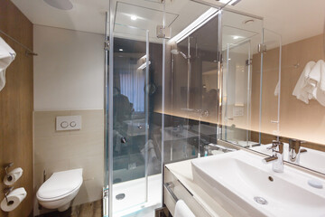 Interior of a bathroom is combined with toilet, nobody