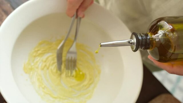 Cook preparing tasty sauce in kitchen