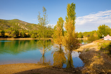View of the Pena reservoir with the last rays of sun at sunset. Beceit, Matarranya, Aragon, Spain