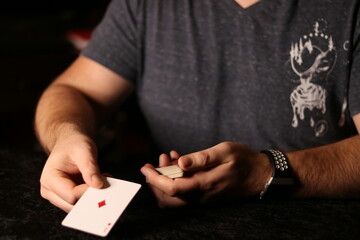 card magician practicing sleight of hand magic Cardestry