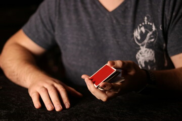 card magician practicing sleight of hand magic