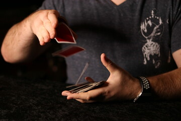 card magician practicing sleight of hand magic