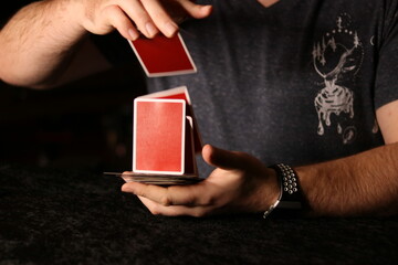 card magician practicing sleight of hand magic