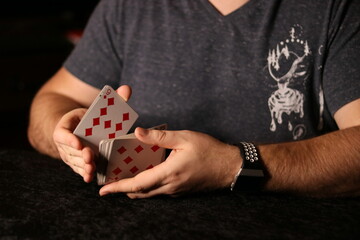 card magician practicing sleight of hand magic