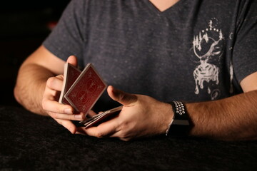 card magician practicing sleight of hand magic