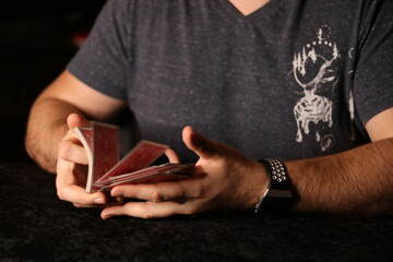 card magician practicing sleight of hand magic