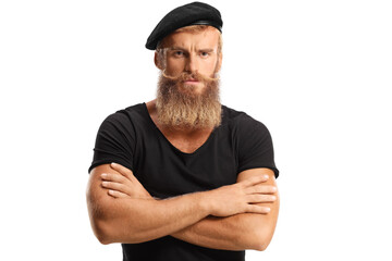 Serious young man with blond beard and mosutaches wearing a black beret hat