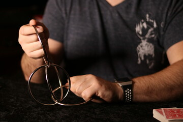 close up of a magician practicing a ring trick