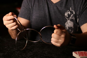 close up of a magician practicing a ring trick