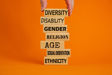 Diversity ethnicity gender age sexual orientation religion disability words written on wooden...