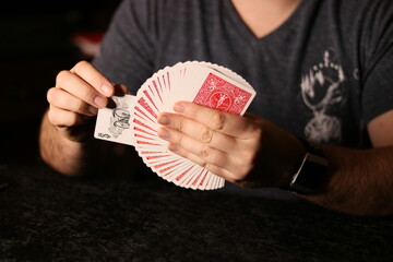 card magician practicing sleight of hand magic