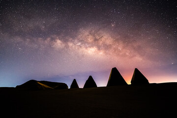 Pyramids in Sudan at Night with milky way starry background