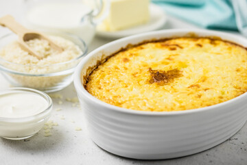 Cheesy rice casserole, rice, butter, cream. Space for text.