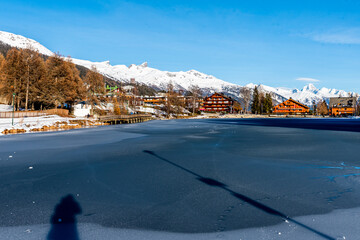 Winter landscape with river and snow in Crans Montana in Switzerland. Tranquil scene.