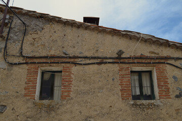 Fototapeta na wymiar Two old small windows in a village
