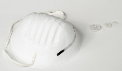 COVID PPE Mask and Hand Sanitizer Drops on White Background
