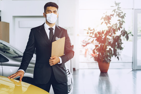 Man Car Dealer Wearing Protective Medical Mask On His Working Place