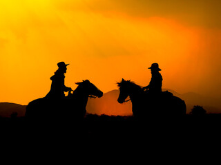The Western Cowboy forced his horses to stop while the sun was setting, In lands where the law has...