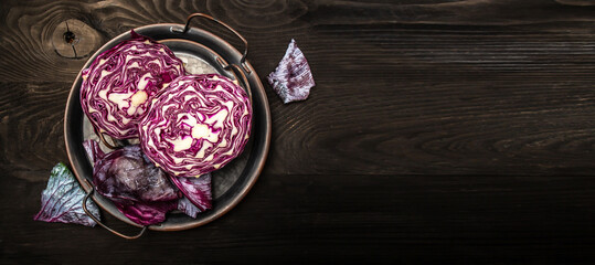 Purple cabbages, red cabbage organic farming on a wood, Portion of Red Coleslaw on wooden background, Vegetarian healthy food, Long banner format, top view