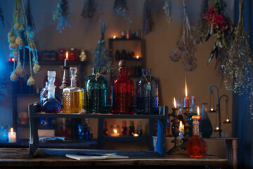 magic potions in witch's house with burning candles at night