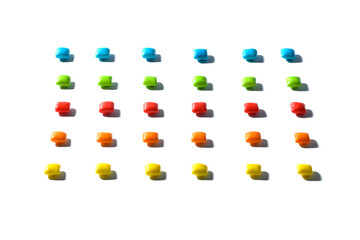 Colorful candies , dragee, chewing gum are placed in a row with a contrasting shadow on a white isolated background with focus stacking. Advertising label design element. Full depth of field.  .