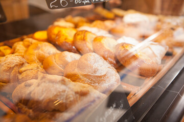 Close up of bakery showcase full of delicious pastry for sale