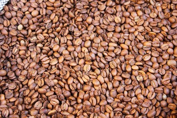 Raw coffee beans in sacks, coffee shop in Athens, Greece.